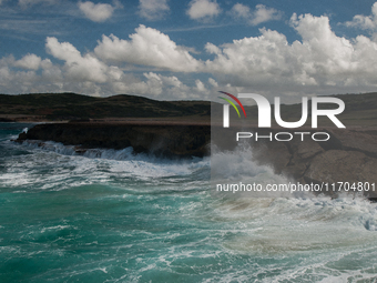 Andicuri Bay is a wide bay enclosed by coral-stone cliffs, some of which provide a little shade. Due to its perfect waves and stronger surf,...