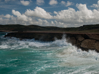 Andicuri Bay is a wide bay enclosed by coral-stone cliffs, some of which provide a little shade. Due to its perfect waves and stronger surf,...