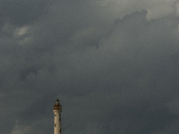 The California Lighthouse, known by locals as Faro, stands tall on a limestone plateau at Hudishibana, near Arashi Beach and Sasariwichi dun...