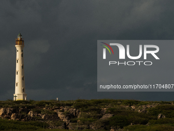 The California Lighthouse, known by locals as Faro, stands tall on a limestone plateau at Hudishibana, near Arashi Beach and Sasariwichi dun...