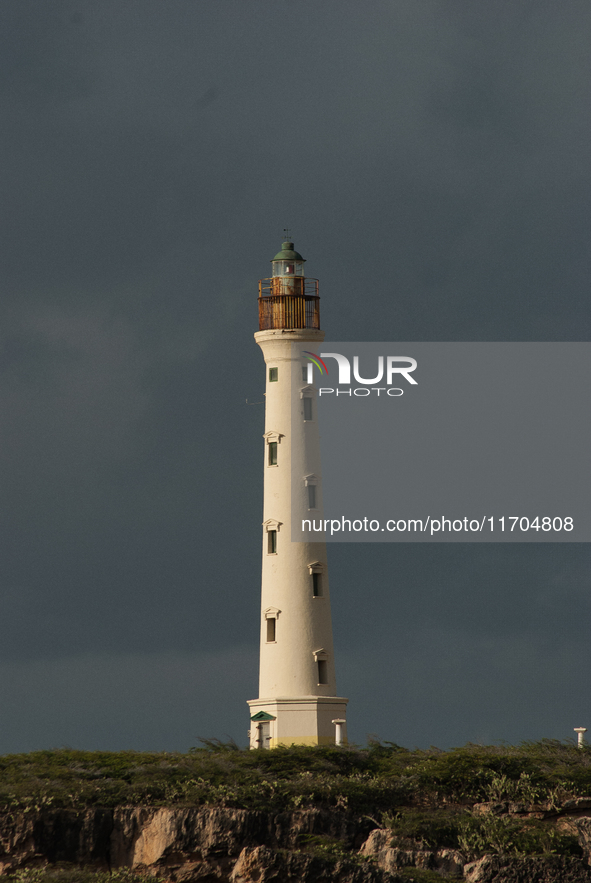 The California Lighthouse, known by locals as Faro, stands tall on a limestone plateau at Hudishibana, near Arashi Beach and Sasariwichi dun...