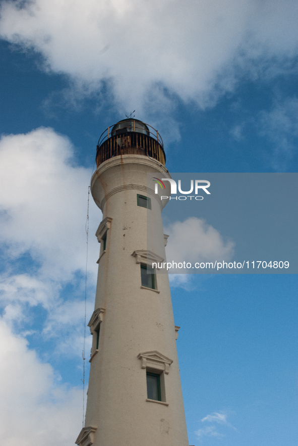 The California Lighthouse, known by locals as Faro, stands tall on a limestone plateau at Hudishibana, near Arashi Beach and Sasariwichi dun...