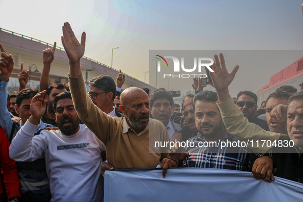 Member of Parliament Sheikh Abdul Rashid, also known as Engineer Rashid, (C) shouts slogans during a protest in Srinagar, Jammu and Kashmir,...