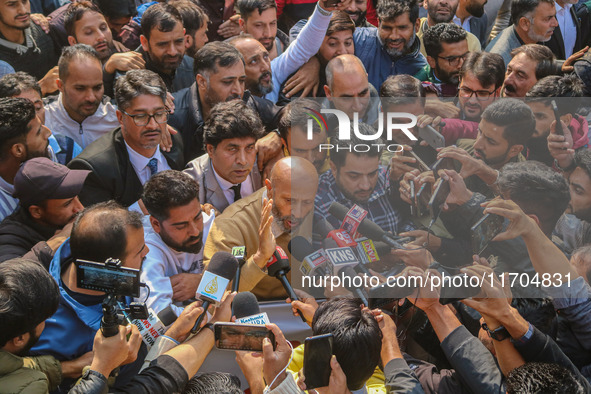 Member of Parliament Sheikh Abdul Rashid, also known as Engineer Rashid, (C) talks with members of the media during a protest in Srinagar, J...