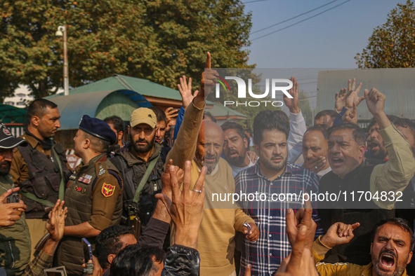 Member of Parliament Sheikh Abdul Rashid, also known as Engineer Rashid, (C) shouts slogans during a protest in Srinagar, Jammu and Kashmir,...