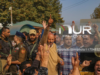 Member of Parliament Sheikh Abdul Rashid, also known as Engineer Rashid, (C) shouts slogans during a protest in Srinagar, Jammu and Kashmir,...