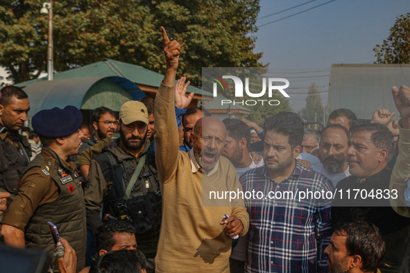 Member of Parliament Sheikh Abdul Rashid, also known as Engineer Rashid, (C) shouts slogans during a protest in Srinagar, Jammu and Kashmir,...