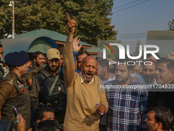 Member of Parliament Sheikh Abdul Rashid, also known as Engineer Rashid, (C) shouts slogans during a protest in Srinagar, Jammu and Kashmir,...