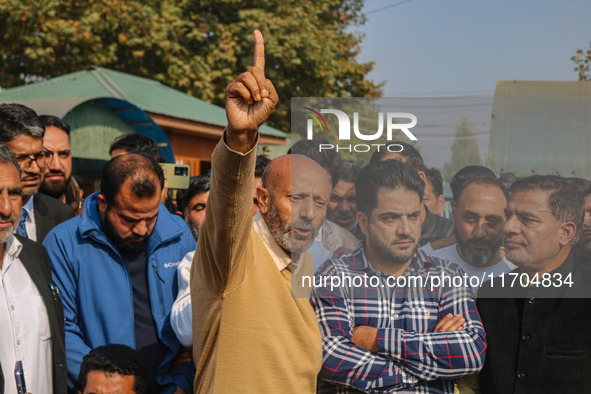 Member of Parliament Sheikh Abdul Rashid, also known as Engineer Rashid, (C) shouts slogans during a protest in Srinagar, Jammu and Kashmir,...