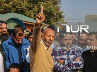 Member of Parliament Sheikh Abdul Rashid, also known as Engineer Rashid, (C) shouts slogans during a protest in Srinagar, Jammu and Kashmir,...