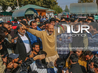 Member of Parliament Sheikh Abdul Rashid, also known as Engineer Rashid, (C) shouts slogans during a protest in Srinagar, Jammu and Kashmir,...