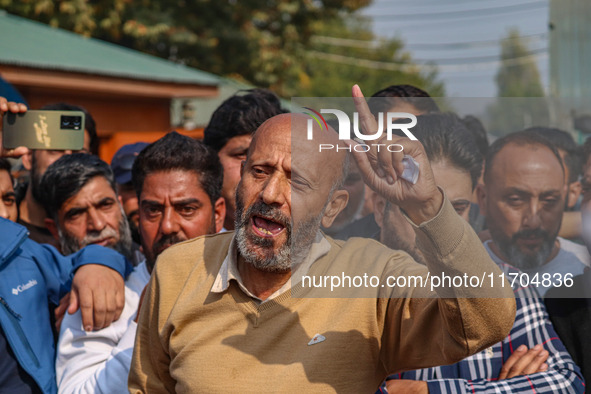 Member of Parliament Sheikh Abdul Rashid, also known as Engineer Rashid, (C) shouts slogans during a protest in Srinagar, Jammu and Kashmir,...