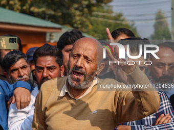 Member of Parliament Sheikh Abdul Rashid, also known as Engineer Rashid, (C) shouts slogans during a protest in Srinagar, Jammu and Kashmir,...