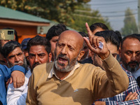 Member of Parliament Sheikh Abdul Rashid, also known as Engineer Rashid, (C) shouts slogans during a protest in Srinagar, Jammu and Kashmir,...