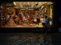 A flooded road is seen in Kolkata, India, on October 25, 2024, after heavy rain brought by the landfall of Cyclone Dana. Cyclone Dana makes...