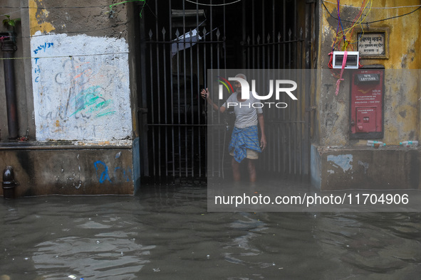 A flooded road is seen in Kolkata, India, on October 25, 2024, after heavy rain brought by the landfall of Cyclone Dana. Cyclone Dana makes...