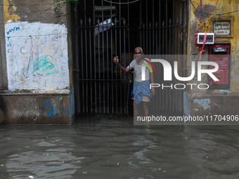 A flooded road is seen in Kolkata, India, on October 25, 2024, after heavy rain brought by the landfall of Cyclone Dana. Cyclone Dana makes...