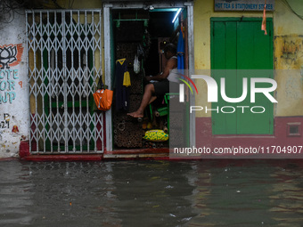 A flooded road is seen in Kolkata, India, on October 25, 2024, after heavy rain brought by the landfall of Cyclone Dana. Cyclone Dana makes...