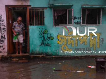 A flooded road is seen in Kolkata, India, on October 25, 2024, after heavy rain brought by the landfall of Cyclone Dana. Cyclone Dana makes...