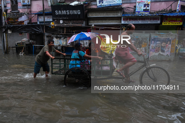 A flooded road is seen in Kolkata, India, on October 25, 2024, after heavy rain brought by the landfall of Cyclone Dana. Cyclone Dana makes...