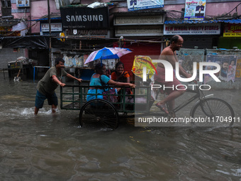 A flooded road is seen in Kolkata, India, on October 25, 2024, after heavy rain brought by the landfall of Cyclone Dana. Cyclone Dana makes...