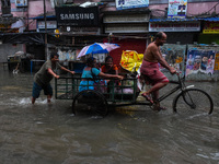 A flooded road is seen in Kolkata, India, on October 25, 2024, after heavy rain brought by the landfall of Cyclone Dana. Cyclone Dana makes...