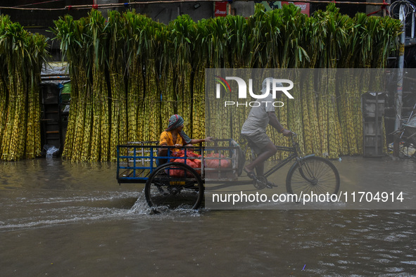 A flooded road is seen in Kolkata, India, on October 25, 2024, after heavy rain brought by the landfall of Cyclone Dana. Cyclone Dana makes...