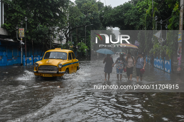 A flooded road is seen in Kolkata, India, on October 25, 2024, after heavy rain brought by the landfall of Cyclone Dana. Cyclone Dana makes...