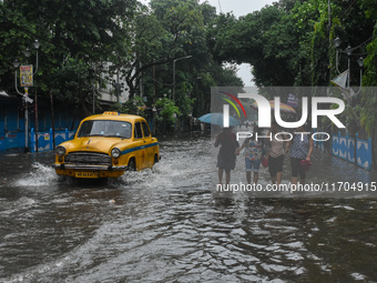 A flooded road is seen in Kolkata, India, on October 25, 2024, after heavy rain brought by the landfall of Cyclone Dana. Cyclone Dana makes...