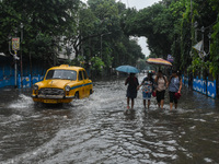 A flooded road is seen in Kolkata, India, on October 25, 2024, after heavy rain brought by the landfall of Cyclone Dana. Cyclone Dana makes...