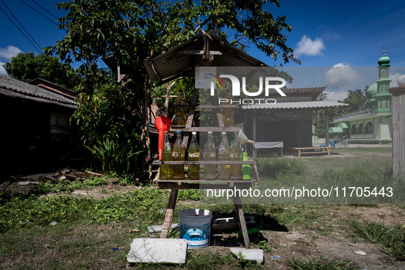 A rural roadside petrol refill station is part of daily life in Tak Bai, Narathiwat, Thailand, on October 25, 2024. Tak Bai is the site of a...