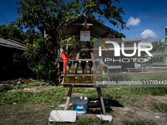 A rural roadside petrol refill station is part of daily life in Tak Bai, Narathiwat, Thailand, on October 25, 2024. Tak Bai is the site of a...