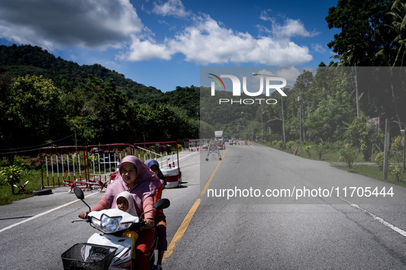 Motorists pass through a checkpoint in Pattani. Daily life in Tak Bai, Narathiwat, Thailand, on October 25, 2024. Tak Bai is the site of an...