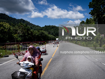 Motorists pass through a checkpoint in Pattani. Daily life in Tak Bai, Narathiwat, Thailand, on October 25, 2024. Tak Bai is the site of an...