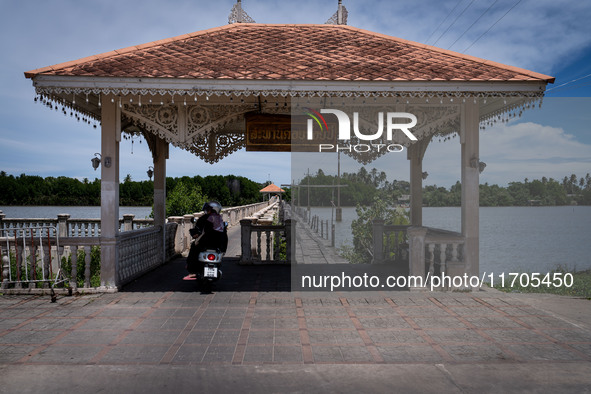 People ride motorcycles across a bridge in Tak Bai. Daily life in Tak Bai, Narathiwat, Thailand, on October 25, 2024. Tak Bai is the site of...