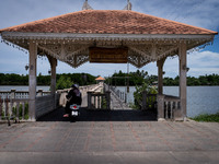 People ride motorcycles across a bridge in Tak Bai. Daily life in Tak Bai, Narathiwat, Thailand, on October 25, 2024. Tak Bai is the site of...