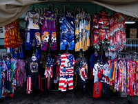 Various items, including USA merchandise, are for sale at a street vendor in Tak Bai. Daily life continues in Tak Bai, Narathiwat, Thailand,...