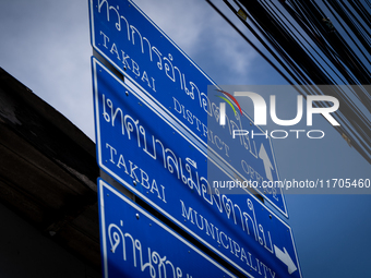 Traffic signs point to Tak Bai areas. Daily life occurs in Tak Bai, Narathiwat, Thailand, on October 25, 2024. Tak Bai is the site of an inc...