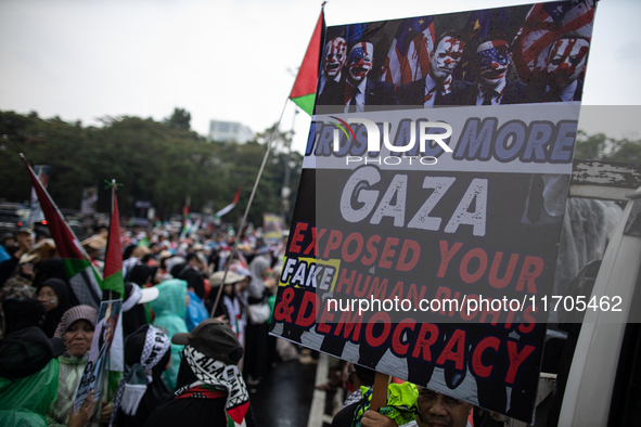 People take part in a rally in solidarity with the Palestinian people outside the US embassy in Jakarta, Indonesia, on October 25, 2024. The...