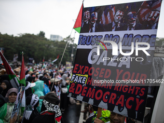 People take part in a rally in solidarity with the Palestinian people outside the US embassy in Jakarta, Indonesia, on October 25, 2024. The...