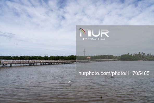 A large bridge leads to the beach in Tak Bai. Daily life in Tak Bai, Narathiwat, Thailand, on October 25, 2024, reflects the history of an i...