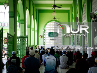 Muslims pray at Ihsaniyah Mosque in Tak Bai. Daily life in Tak Bai, Narathiwat, Thailand, on October 25, 2024, continues as the statute of l...