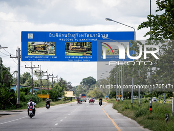 A sign welcomes motorists to Narathiwat province. Daily life occurs in Tak Bai, Narathiwat, Thailand, on October 25, 2024. Tak Bai is the si...