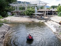 Children play in the river at Wadil-Husen Mosque in Pattani. Daily life occurs in Tak Bai, Narathiwat, Thailand, on October 25, 2024. Tak Ba...