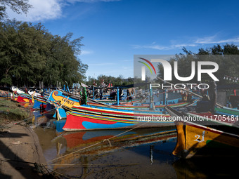 Longtail fishing boats park near the fisherman's village area of Narathiwat. Daily life in Tak Bai, Narathiwat, Thailand, on October 25, 202...