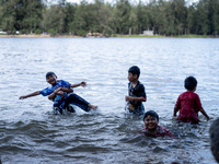 Children play in the sea in Narathiwat. Daily life in Tak Bai, Narathiwat, Thailand, on October 25, 2024. Tak Bai is the site of an incident...