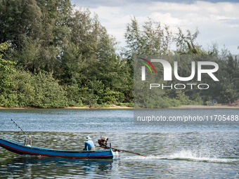 A longtail boat fisherman heads out to sea in Narathiwat. Daily life in Tak Bai, Narathiwat, Thailand, on October 25, 2024. Tak Bai is the s...