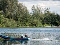 A longtail boat fisherman heads out to sea in Narathiwat. Daily life in Tak Bai, Narathiwat, Thailand, on October 25, 2024. Tak Bai is the s...