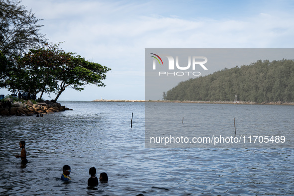 Children play in the sea in Narathiwat. Daily life in Tak Bai, Narathiwat, Thailand, on October 25, 2024. Tak Bai is the site of an incident...