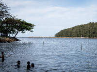 Children play in the sea in Narathiwat. Daily life in Tak Bai, Narathiwat, Thailand, on October 25, 2024. Tak Bai is the site of an incident...